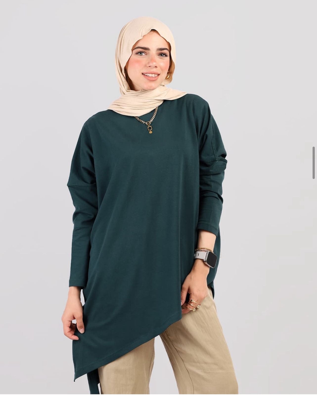 Woman wearing a green long-sleeve top